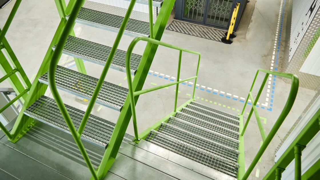 Emergency stairwell inside a multi storey building providing a protected escape route during a fire.