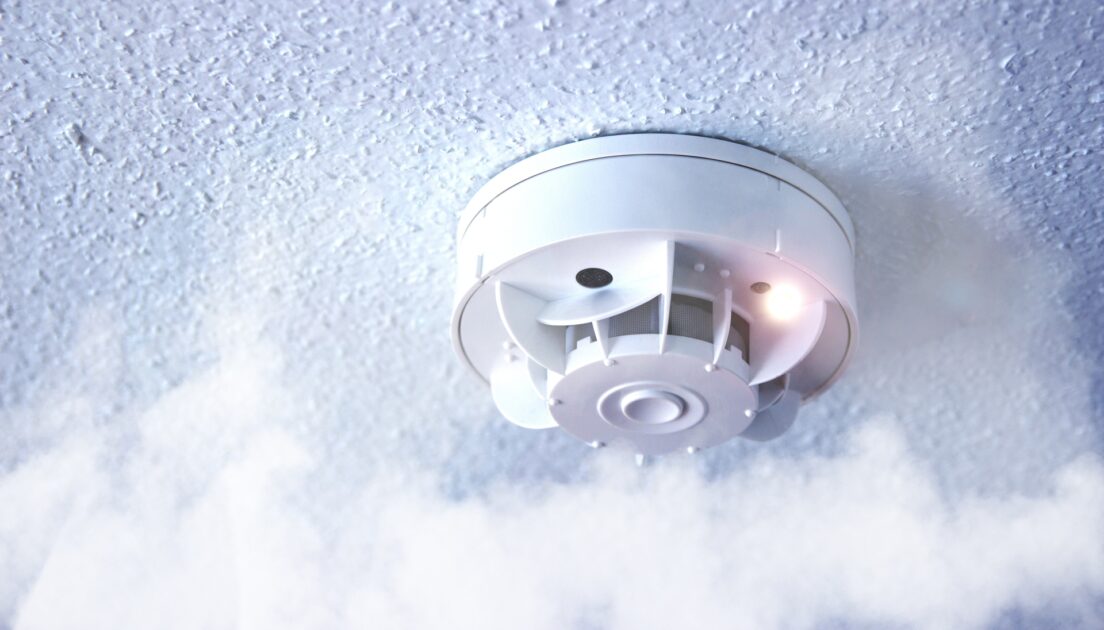 Ceiling mounted smoke detector used as part of a building fire detection system.